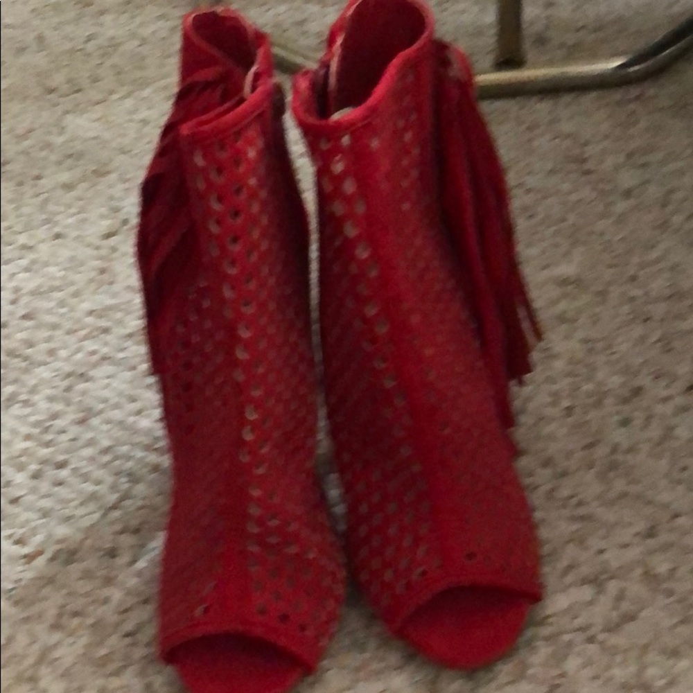 Red booties with perforated upper.  Side zip